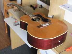 Bridge re-glue on a 1970's Guild 12-String acoustic guitar by South Austin Guitar Repair