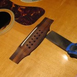 Bridge re-glue on a 1970's Guild 12-String acoustic guitar by South Austin Guitar Repair