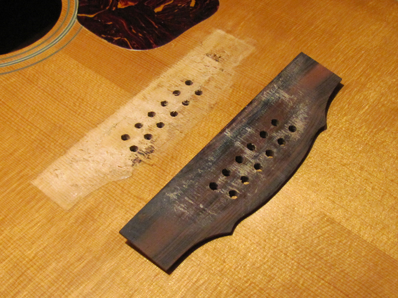 Bridge re-glue on a 1970's Guild 12-String acoustic guitar by South Austin Guitar Repair