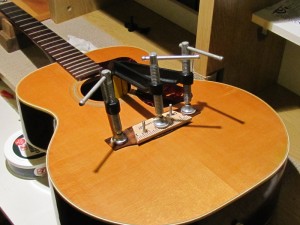 Bridge re-glue on a 1970's Guild 12-String acoustic guitar by South Austin Guitar Repair